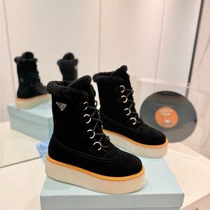 Prada Black and Tan Winter Boots